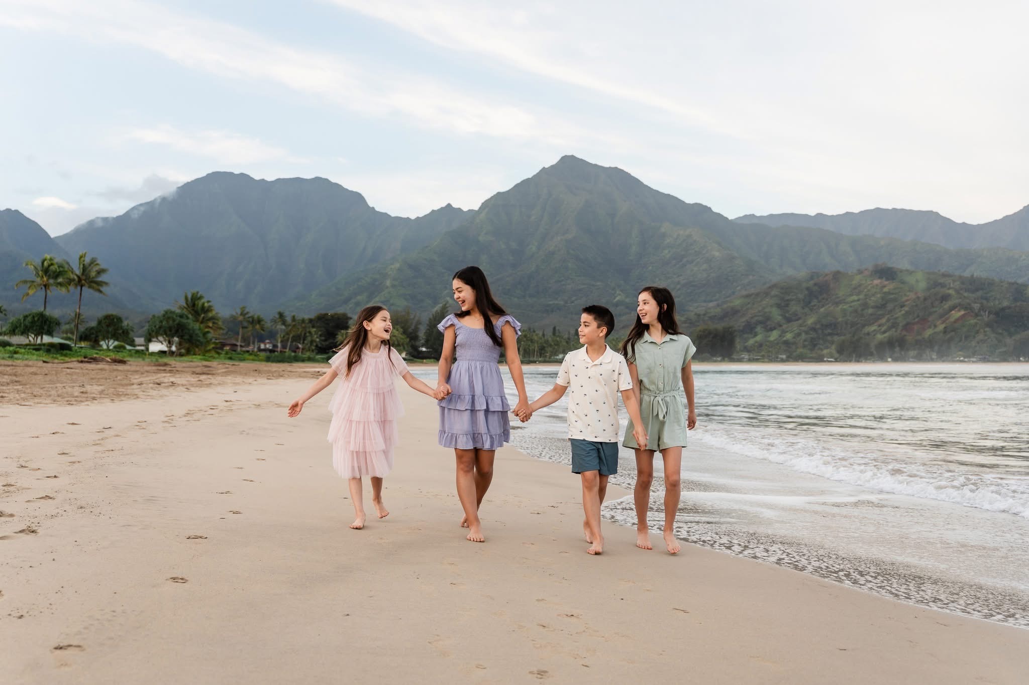 Family on a Hawaii beach in coordinated outfits